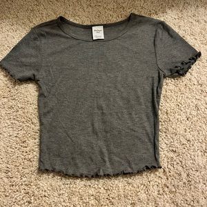 A gray cropped top.